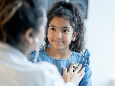 Doctor attending female child